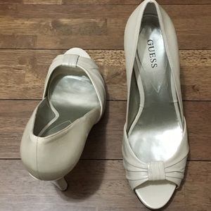 Used Guess size 8 nude peep toe pumps
